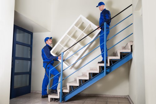 Removal team handling furniture and boxes during a local move