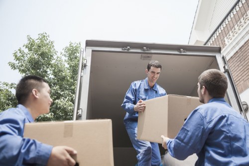 Removal van and moving team working in a coastal Nags Head residential area