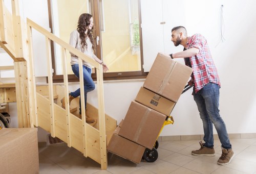 Careful loading of household items into a removals van